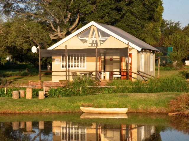 Front view of cottage across the dam
