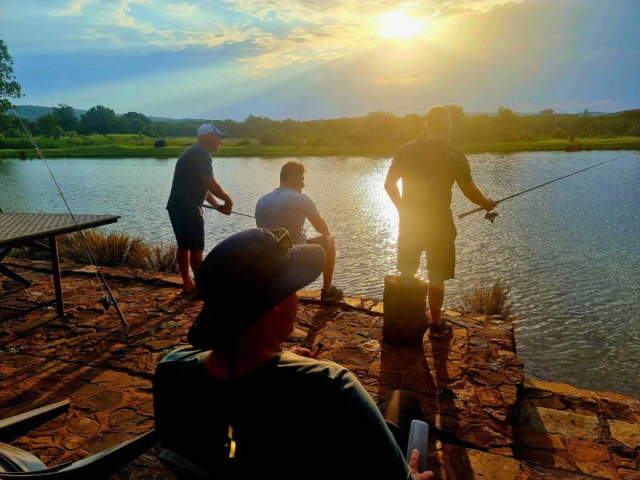 campsites and a caravan site people fishing